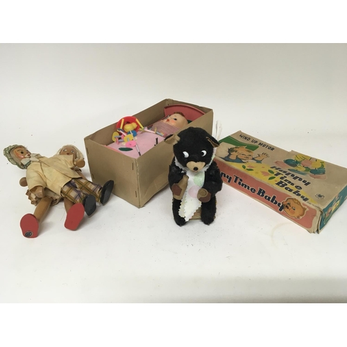 2024 - A Vintage clockwork Milk bear a boxed Happy  Time Baby and two wooden dolls. (a lot)