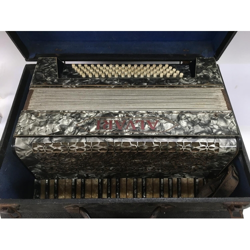 2031 - A cased Alvari accordion.