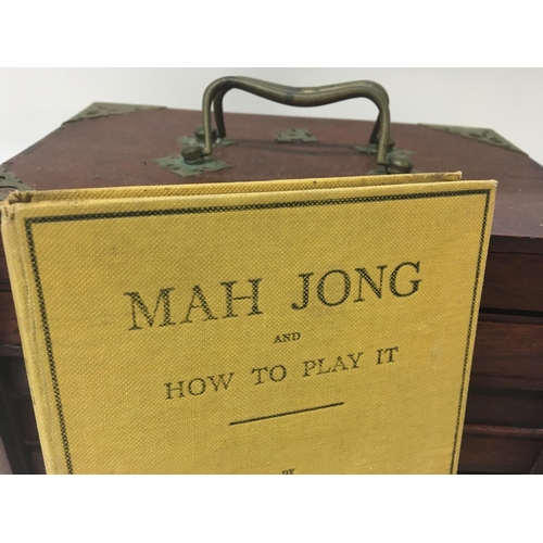 2039 - A bone Mah Jong set fitted in five drawers with book .