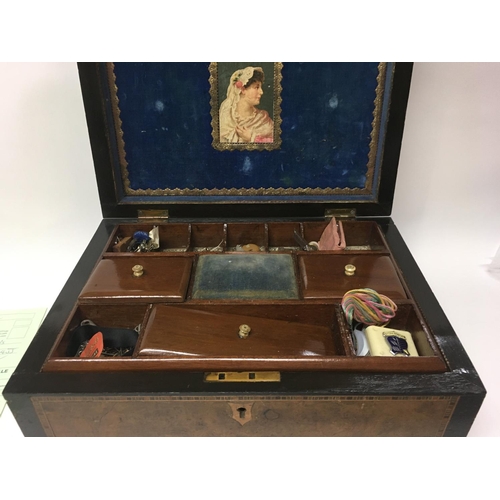 2045 - A Victorian sewing box the hinge lid inlaid with a three mast sailing ship enclosing a fitted interi... 