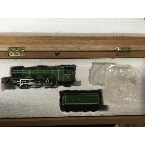 2046 - A box containing various model trains .