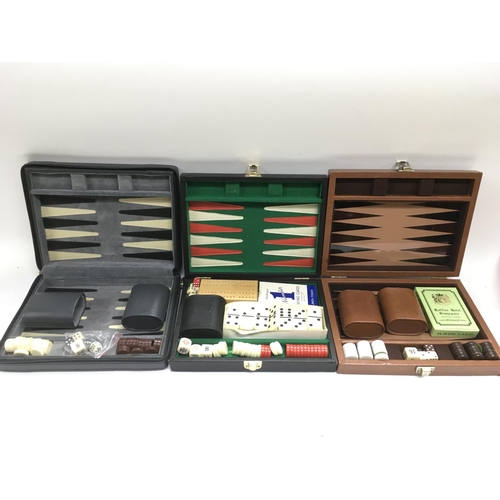 2048 - Three travel backgammon sets including one from Harrods together with other gaming items.