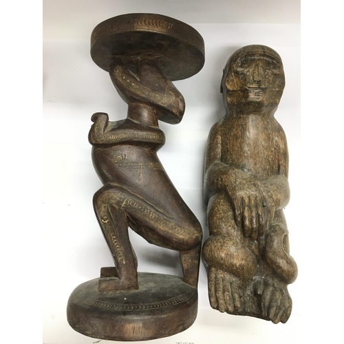 2050 - Tribal art. An unusual carved figural table, approx height 43cm, together with another wood carving ... 