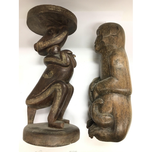 2050 - Tribal art. An unusual carved figural table, approx height 43cm, together with another wood carving ... 