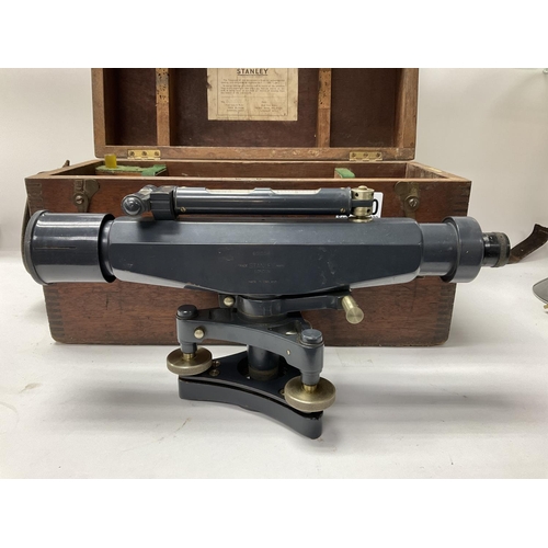 2060 - A cased vintage Stanley Surveyors level, model 601554. Together with tripod and measure.