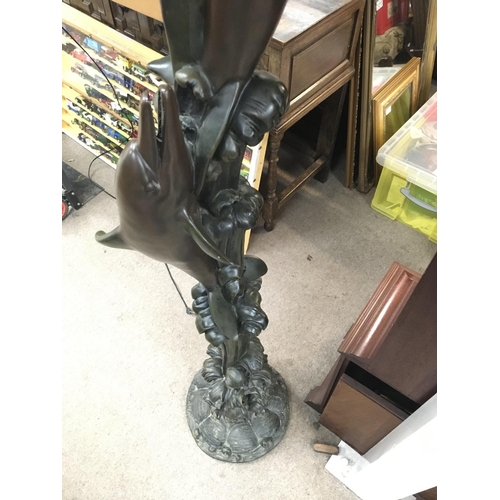 2070 - A modern design dolphin stand lamp with shade. Approximately 6ft tall.