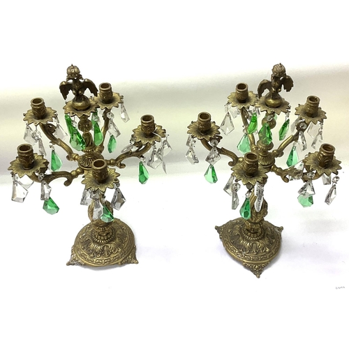 2071 - A pair of gilt brass candelabra with clear and green glass lustre drops mounted with a Prussian doub... 