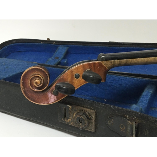 2091 - A 3/4 size violin in a fitted case with bow for restoration with applied Antoninus Stradivarius labe... 