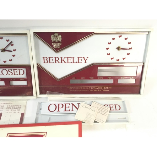 2098 - Three vintage wall shop displays for cigarettes with clocks (battery operated)