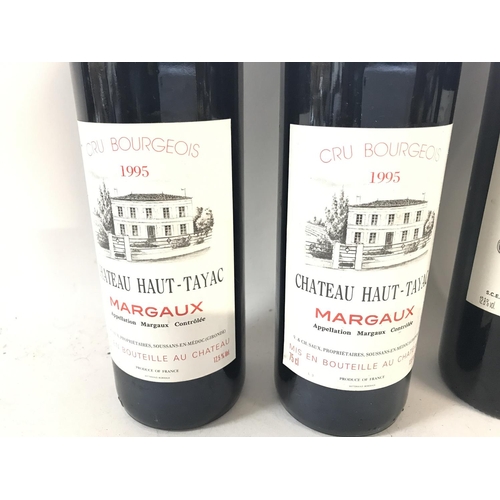 2122 - Four bottles of red wine including two bottle of 1995 Chateau Haut-Tayac Margaux and two bottles of ... 