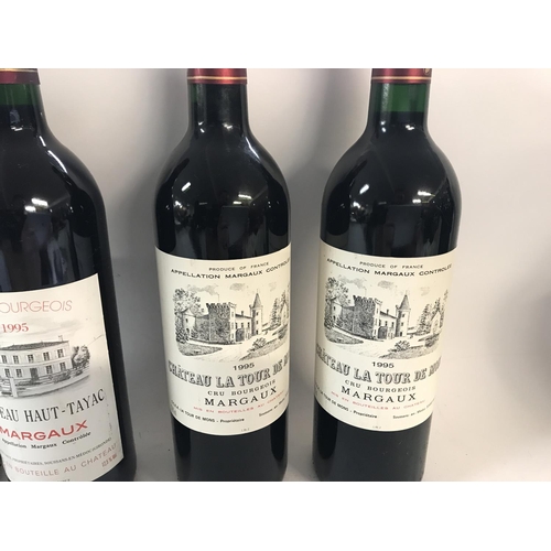 2122 - Four bottles of red wine including two bottle of 1995 Chateau Haut-Tayac Margaux and two bottles of ... 