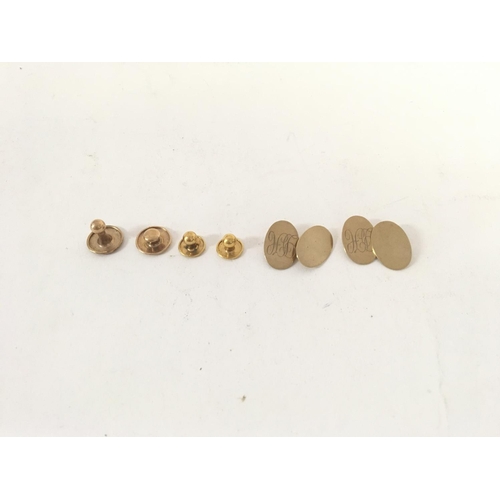 709 - A 9ct gold studs and cuff link set. Weight 9.3g total.