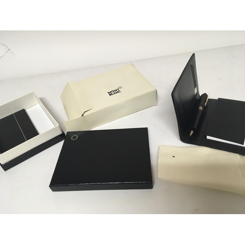 757 - A Genuine Mount Blanc leather note pad with pen boxed.