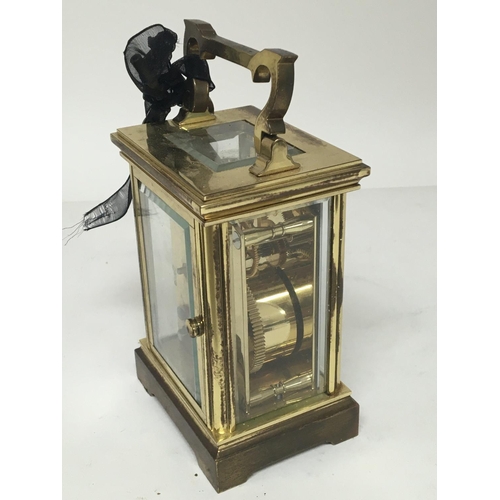 762 - A brass cased Wellington carriage clock.