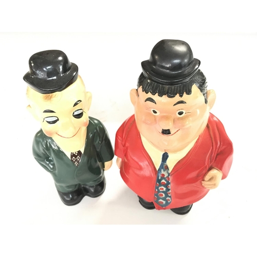 912 - 2 Ceramic Money Boxes in The form of Laurel and Hardy. Maker unknown. Approximate height 20CM.  NO R... 