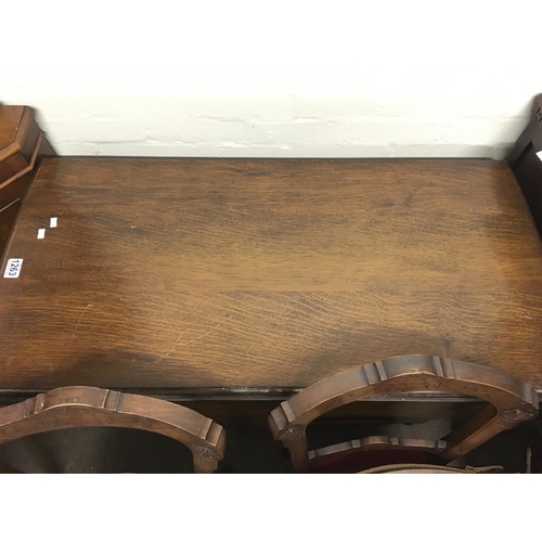 1263 - An oak drop leaf table with a shaped edge on barley twist legs NO RESERVE