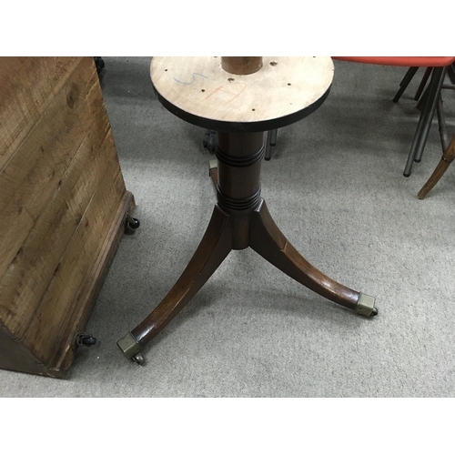 1265 - A Mahogany office drum table the circular top with green leather inset above open section on a turne... 