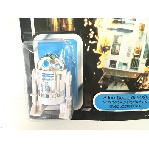 1 - A Carded Vintage Star Wars R2-D2 With Pop Up Light Sabre. Damage to Blister.