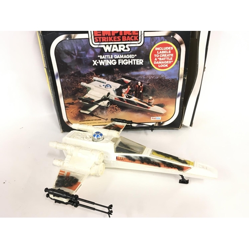 14 - A Boxed Vintage Star Wars Battle Damaged X-Wing.