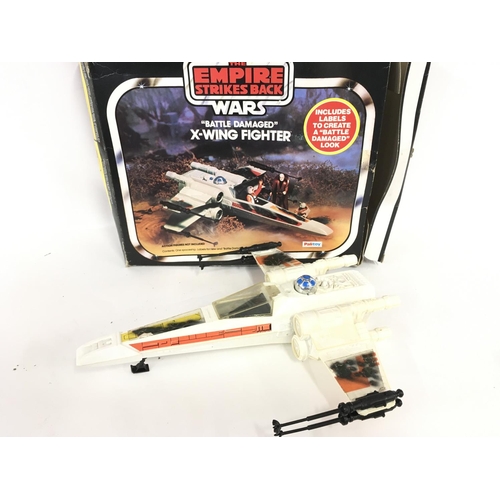 14 - A Boxed Vintage Star Wars Battle Damaged X-Wing.