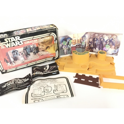 18 - A Boxed Vintage Star Wars Creature Cantina Action Playset. Box is Worn.