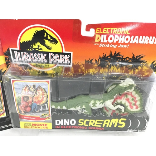 56 - 2 X Jurassic Park Figures Including Dilophosaurus and a Dilophosaurus with Striking Jaw. Both Carded... 