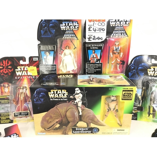 61 - A Collection of Carded Star Wars Figures and a Boxed Dewbak and Sandyrooper.