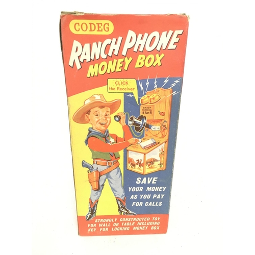 65 - A Boxed Codeg Ranch Phone Money Box.