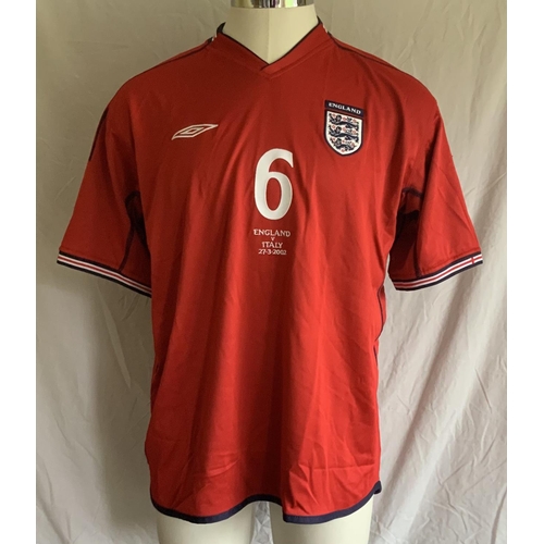 1003 - England 2002 Match Issued Football Shirt: Red short sleeve with number 2 to front and back. Campbell... 