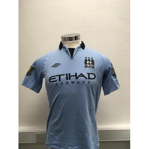 1100 - Manchester City 2012 - 2013 Match Worn Football Shirt: Short sleeve number 5 with gold Premier Leagu... 