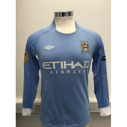 1107 - Manchester City 2010 - 2011 Match Worn Football Shirt: Home long sleeve number 8 with Europa League ... 