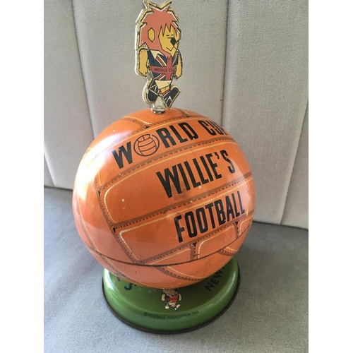 70 - 1966 World Cup Willie Lovells Toffee Tin: Green base with football that originally contained toffees... 