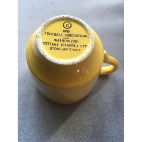 72 - 1966 World Cup Willie Tea Cup: Yellow with handle featuring World Cup Willie. Football Association m... 