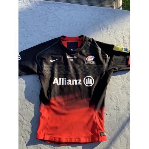 973 - 2015/2016 Saracens Match Worn Rugby Union Shirt: Black and red Nike short sleeve with a Allianz spon... 