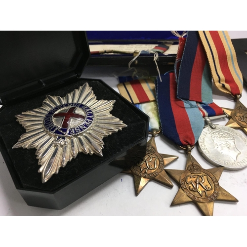 2107 - A group of Second World War medals and certificate of discharge.