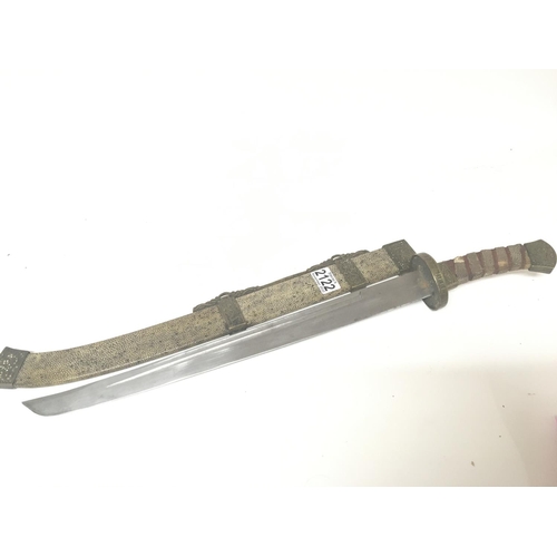 2122 - A Chinese sword the scabbard and grip with applied shagreen and with patterned brass mounts length 6... 