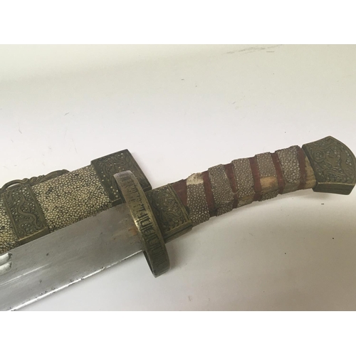 2122 - A Chinese sword the scabbard and grip with applied shagreen and with patterned brass mounts length 6... 