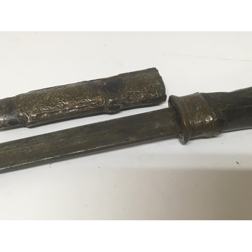 2135 - An antique dagger possible Abyssinian with a horn handle leather and metal mounted scabbard.length 4... 