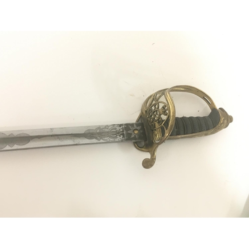 2150 - A Victorian brass field officers sword the decorative guard with Victorian cypher and hinge edge eng... 