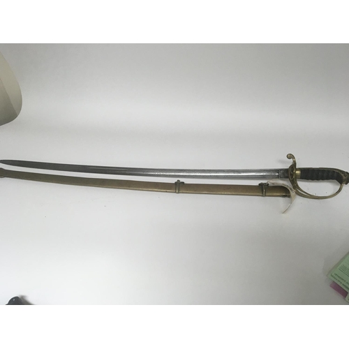 2150 - A Victorian brass field officers sword the decorative guard with Victorian cypher and hinge edge eng... 