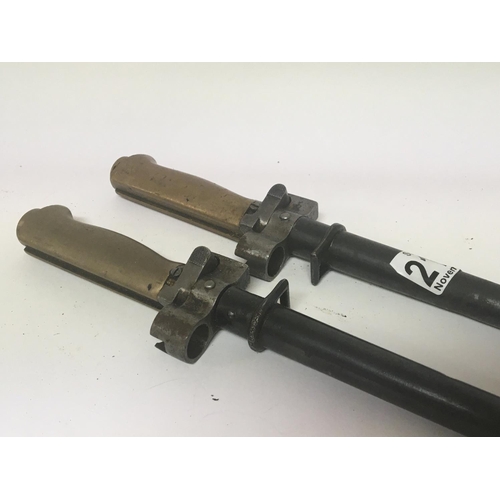 2164 - Two Lebel French stick bayonets with brass grip the M188/35 model. (2)