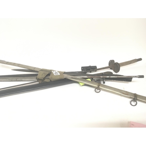 2165 - A fencing foil bayonets an odd scabbard steel ram rod and other oddments (a lot)