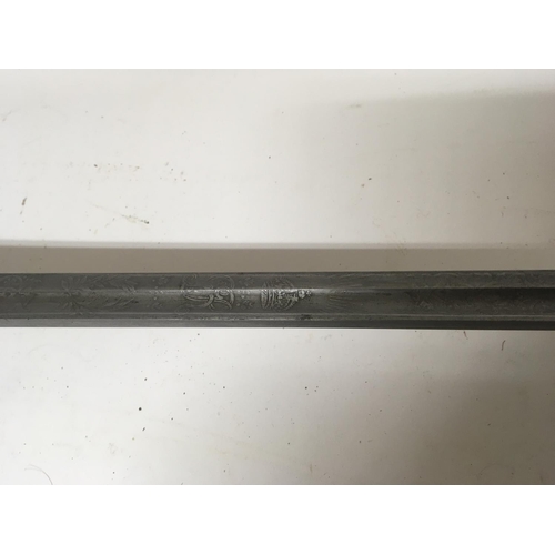 2167 - A George V English Cavalry sword with an enclosed basket hilt engraved steel blade no scabbard.