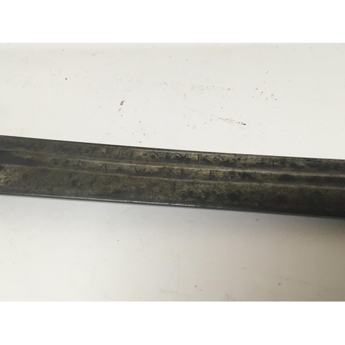 2169 - A Middle Eastern sword with a metal grip curved blade with inscription. Length 94cm