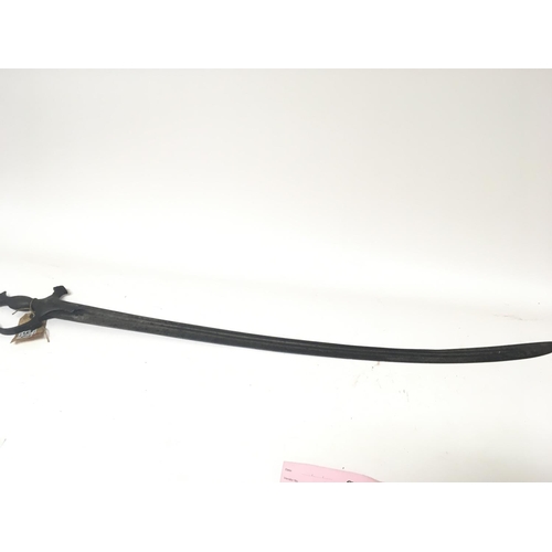 2169 - A Middle Eastern sword with a metal grip curved blade with inscription. Length 94cm