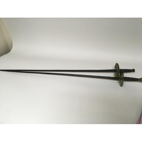 2171 - Two conforming late 19th century swords with round brass guards wired grips and straight tapering st... 