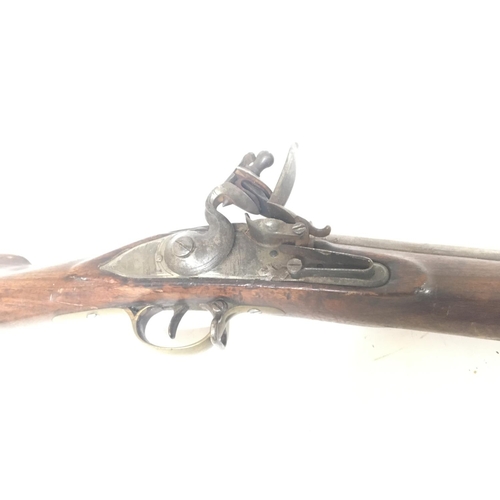 2182 - A late 18th or early 19th century flintlock lock musket rifle the action with ground off marks brass... 