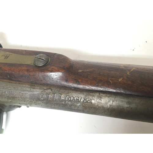 2182 - A late 18th or early 19th century flintlock lock musket rifle the action with ground off marks brass... 