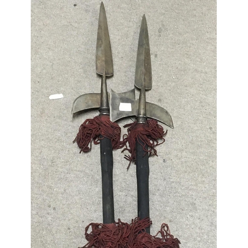 2196 - A set of four Antique Halberds steel ends with wooden shafts.
