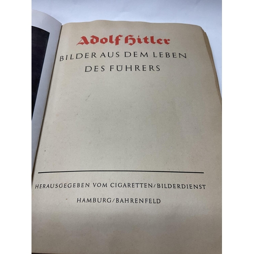 2233 - Adolf Hitler, a book about. Published in German with applied black and white photographs, dated 1936... 